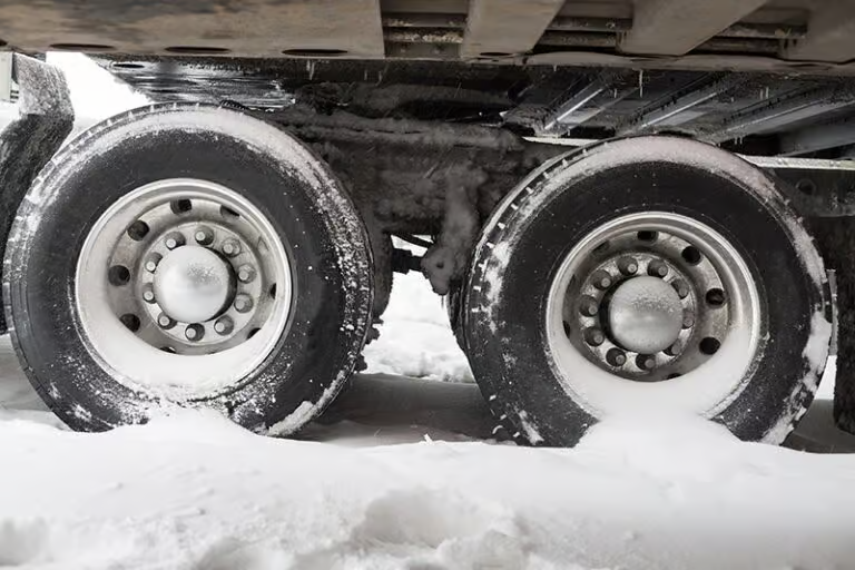 How can I avoid having a serious car crash with a large truck or semi tractor-trailer while driving in Kansas, Image